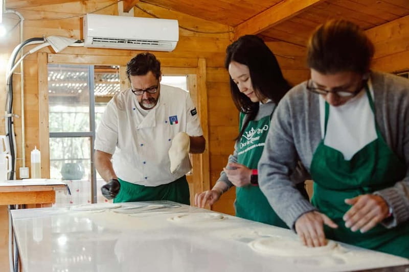 Rome: Combo Pizza and Pasta Cooking Class with Wine - The Roman garden setting: wood houses, open air, and chef-led energy