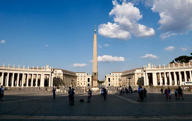 Rome: Guided Tour of St. Peter's Basilica, Grottoes & Square - The Canopy and Tomb Stops: Scale, Power, and the Original Walls